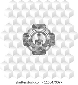 graduated icon inside retro style grey emblem with geometric cube white background