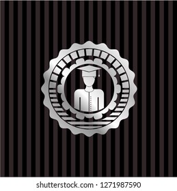 graduated icon inside silver emblem