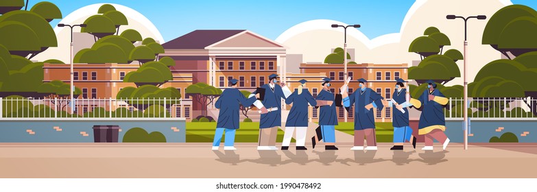 graduated students standing near university building graduates celebrating academic diploma degree education