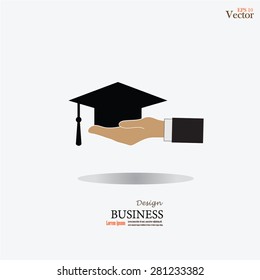 graduation cap in hand on gray background.hand with graduation icon.vector illustration.