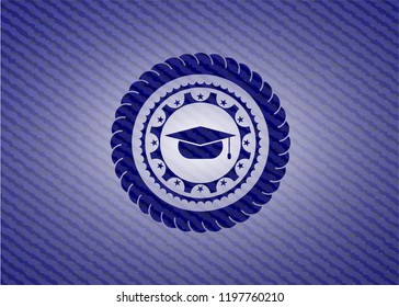 graduation cap icon inside badge with denim texture