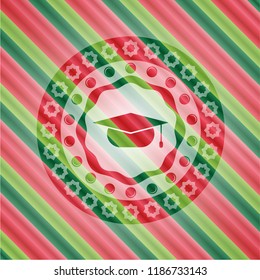 graduation cap icon inside christmas style badge..