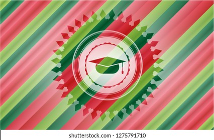 graduation cap icon inside christmas colors badge.