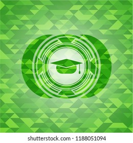 graduation cap icon inside green emblem with mosaic background