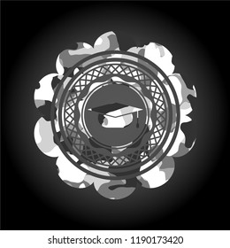 graduation cap icon inside grey camo emblem