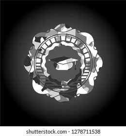 graduation cap icon inside grey camo texture