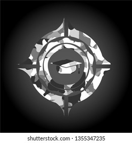 graduation cap icon inside grey camouflaged emblem
