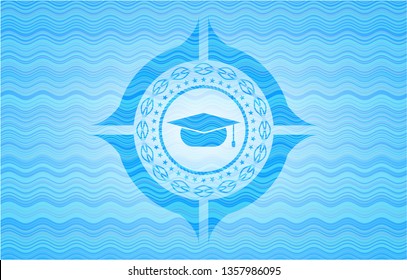 graduation cap icon inside light blue water emblem background.