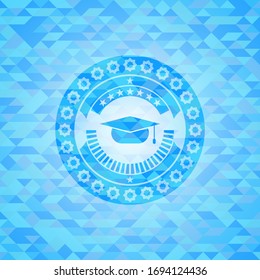 graduation cap icon inside light blue mosaic emblem