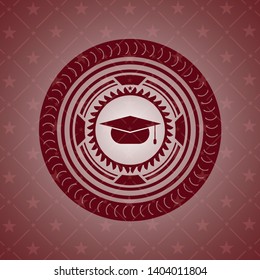 graduation cap icon inside red emblem