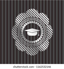 graduation cap icon inside silver emblem or badge