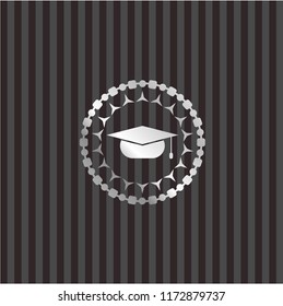 graduation cap icon inside silvery emblem