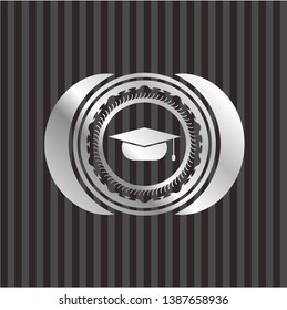 graduation cap icon inside silvery badge
