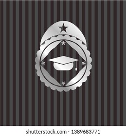 graduation cap icon inside silvery emblem