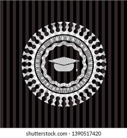 graduation cap icon inside silvery emblem or badge