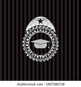 graduation cap icon inside silvery emblem
