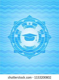 graduation cap icon inside water wave representation badge.
