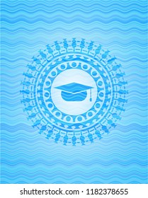 graduation cap icon inside water concept style badge.
