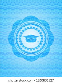 graduation cap icon inside water representation badge background.