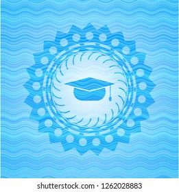 graduation cap icon inside water wave emblem.