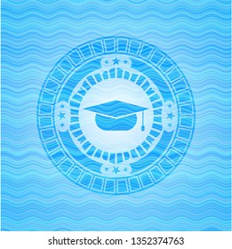 graduation cap icon inside water emblem.