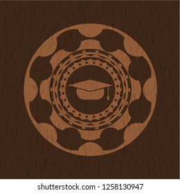graduation cap icon inside wood badge or emblem