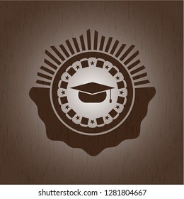 graduation cap icon inside wood badge or emblem