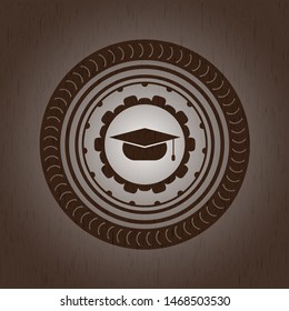 graduation cap icon inside wooden emblem. Vintage.