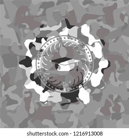 graduation cap icon on grey camouflaged texture