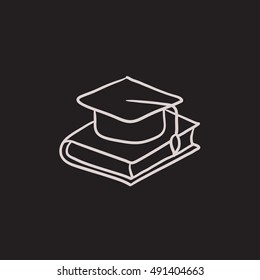 Graduation cap laying on book vector sketch icon isolated on background. Hand drawn Graduation cap laying on book icon. Graduation cap laying on book sketch icon for infographic, website or app.
