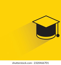 graduation cap with shadow on yellow background