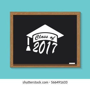 graduation hat  write on school blackboard. Education graduation hat with font 2017. Class of card