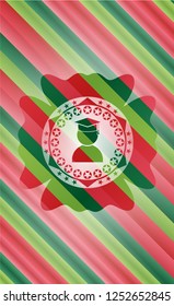 graduation icon inside christmas colors badge.
