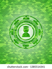 graduation icon inside green mosaic emblem