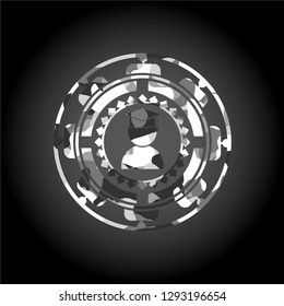 graduation icon inside grey camo emblem