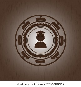 graduation icon inside realistic wooden emblem. 
