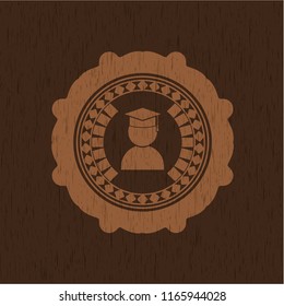 graduation icon inside retro wooden emblem