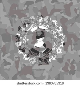 graduation icon on grey camo texture