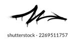 Graffiti arrow with overspray in black over white.