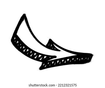 Graffiti arrow with overspray in black over white.