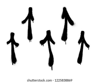 Graffiti arrows set with overspray in black over white.