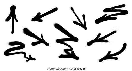 Graffiti arrows set with overspray in black over white.
