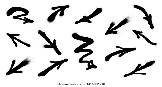 Graffiti arrows set with overspray in black over white.