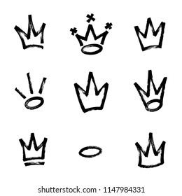 Graffiti crown set in black over white. Drawn by marker. Vector illustration. Eps 10