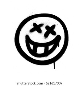 Graffiti emoji with a grin sprayed in black on white