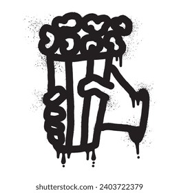 Graffiti of a hand holding popcorn drawn with black spray paint