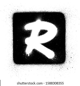 graffiti R font sprayed in white over black square