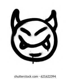 graffiti sprayed devil emoticon in black on white