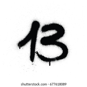 graffiti sprayed number 13 thirteen in black over white