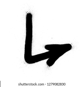 graffiti sprayed pointing arrow in black over white